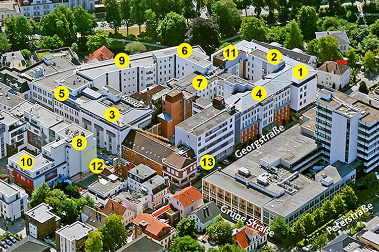 Auf dem zwei Jahre alten Foto des Pius-Hospitals ist das ehemalige Schwesternwohnheim (zwischen den Punkten 3 und 13) noch zu sehen. Mittlerweile wurde es abgerissen, um Platz für den neuen F-Flügel zu schaffen.